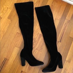 Thigh high black heeled boots
